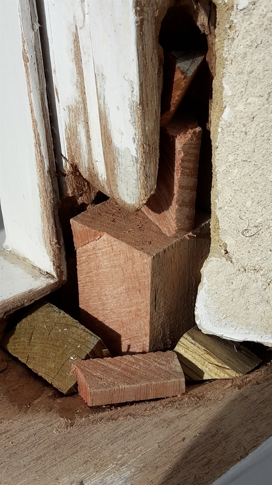 Wood block cut for hole.