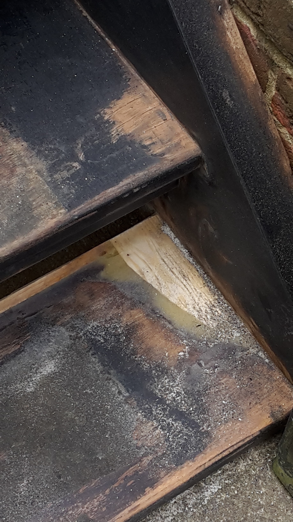 Wood slither put in to fill hole.