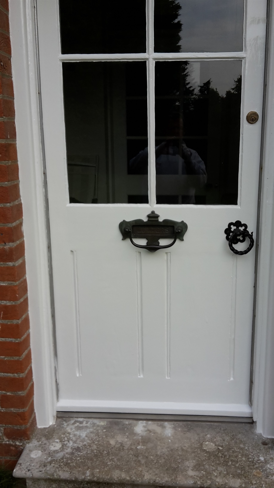 The door grooves had been baddle filled flush. With the joint repairs made it was ok to remove this and return door to its original look.