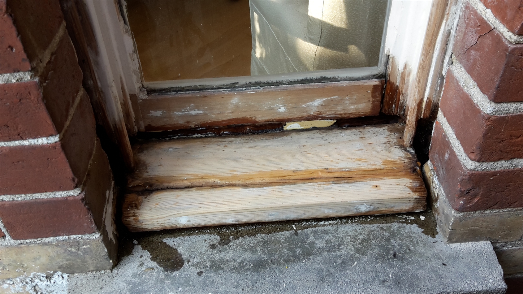 Split in sill due to no support beneath. Strip wood timber and dry flex put in under front to support this.