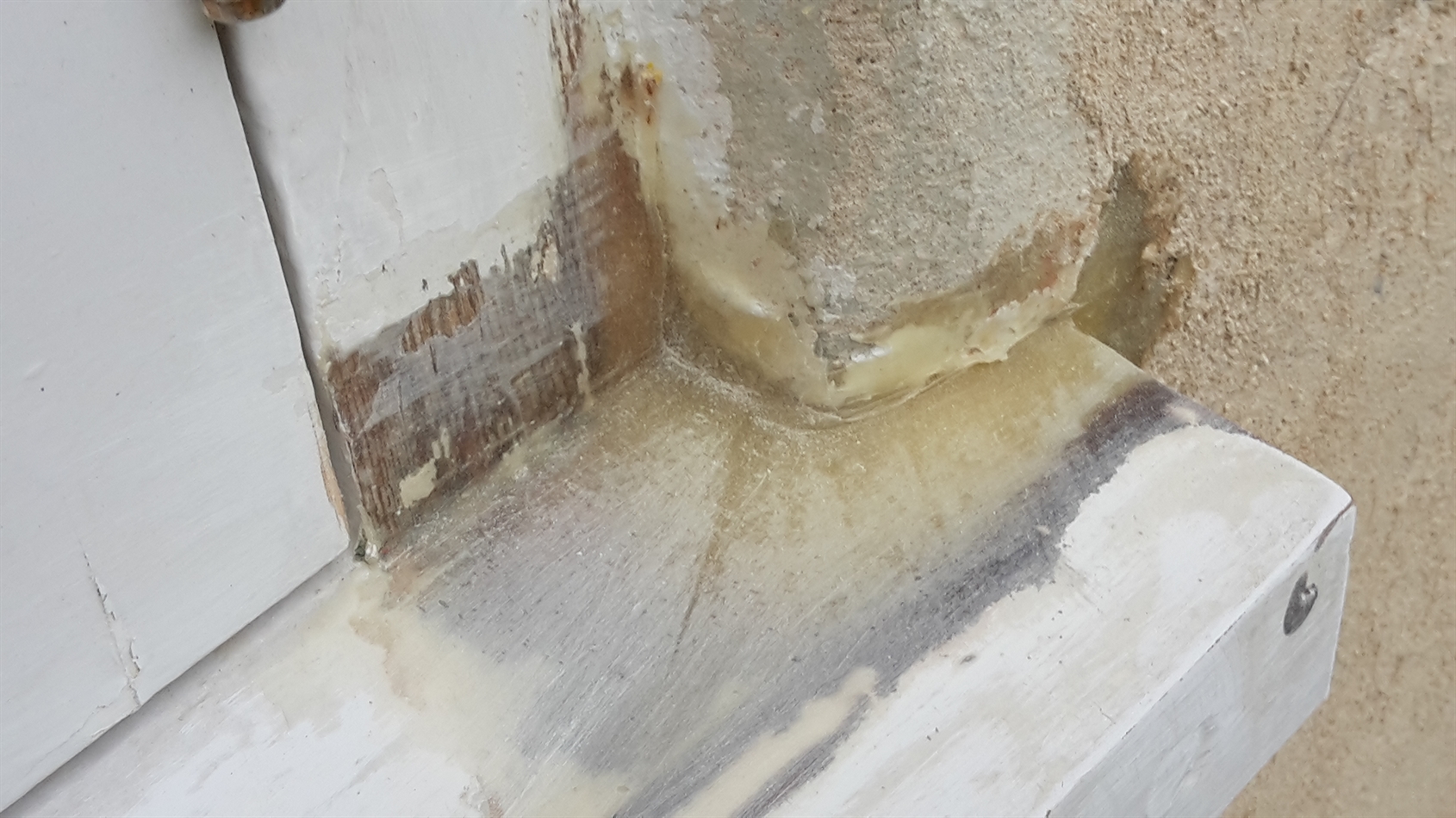 Corner of same window repaired.